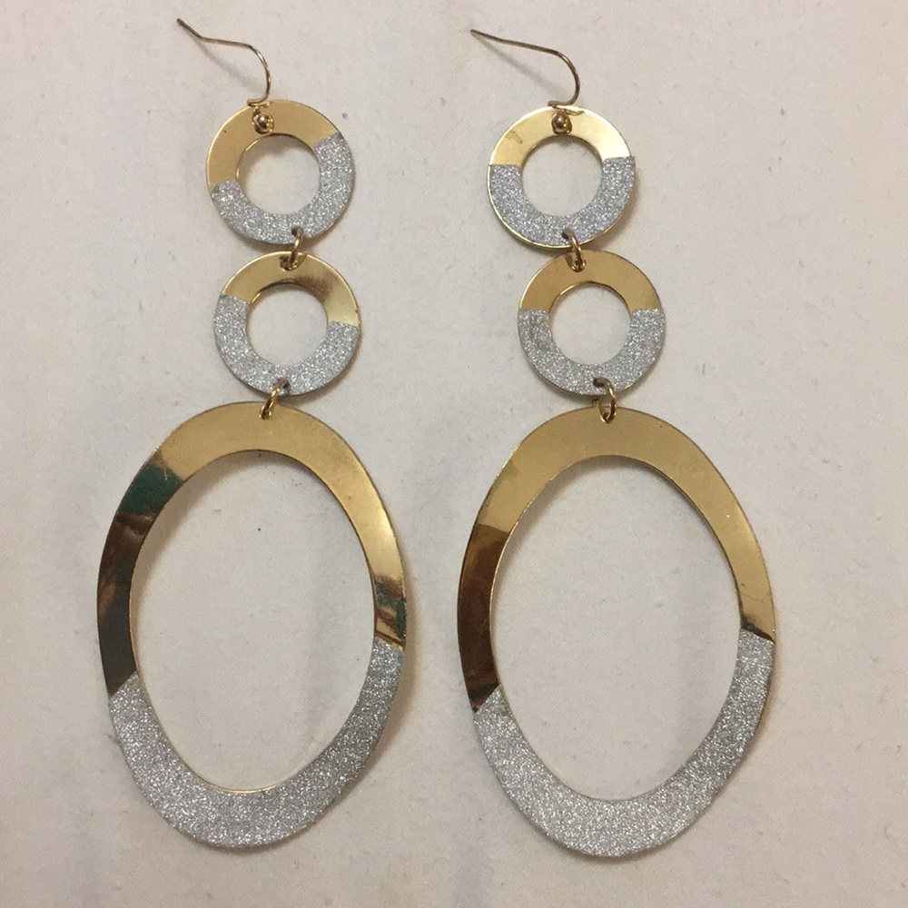 Gold and silver glittery earrings.